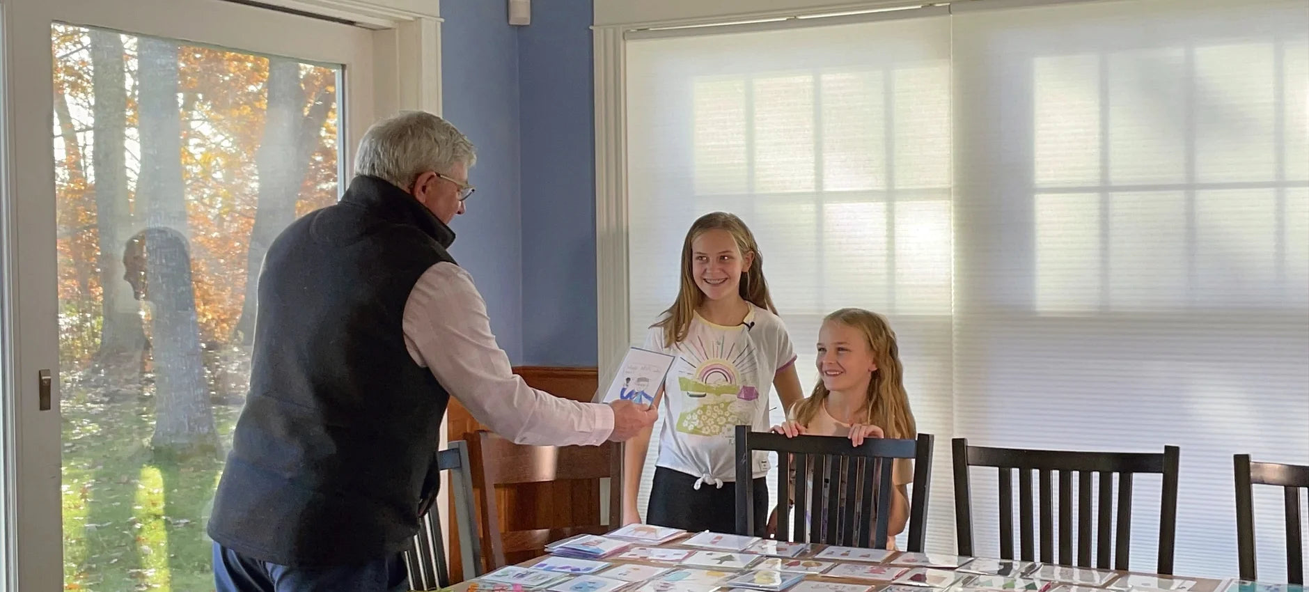 The sisters being interviewed at home.