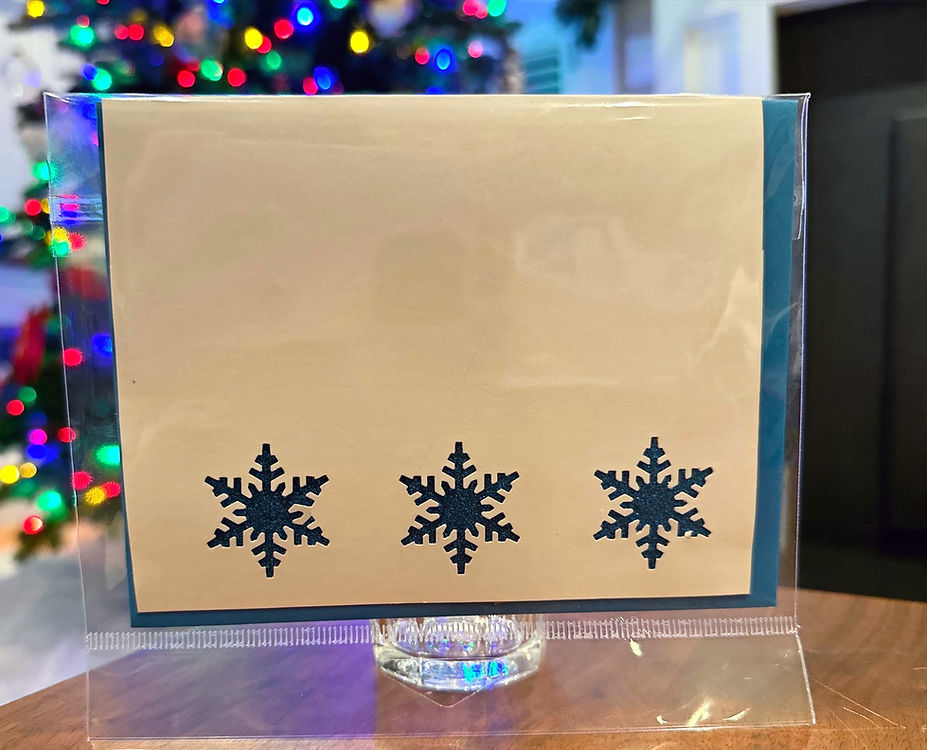 three blue sparkling snowflakes